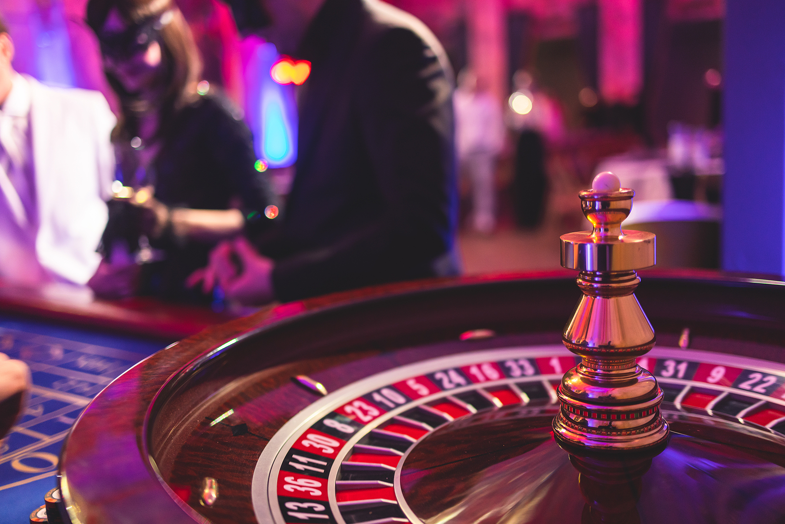 Vibrant casino table with roulette in motion