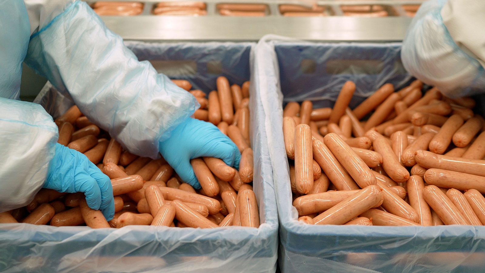 Sausages Are Removed From The Conveyor. Sausages Are Removed Fro