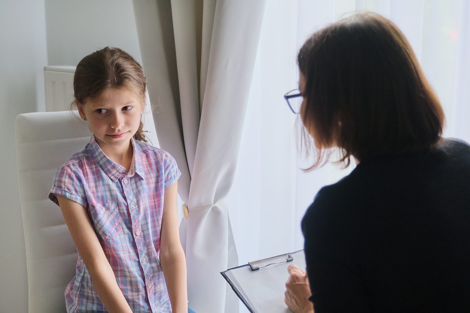 Psychotherapy west london - Meeting child girl with school counselor therapist